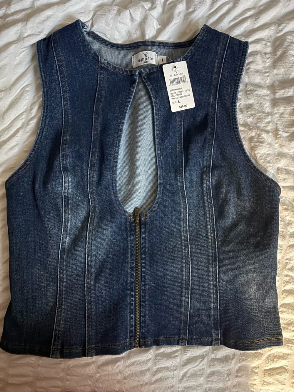Denim vest with zipper and clasp. Brand new with tag. Never worn